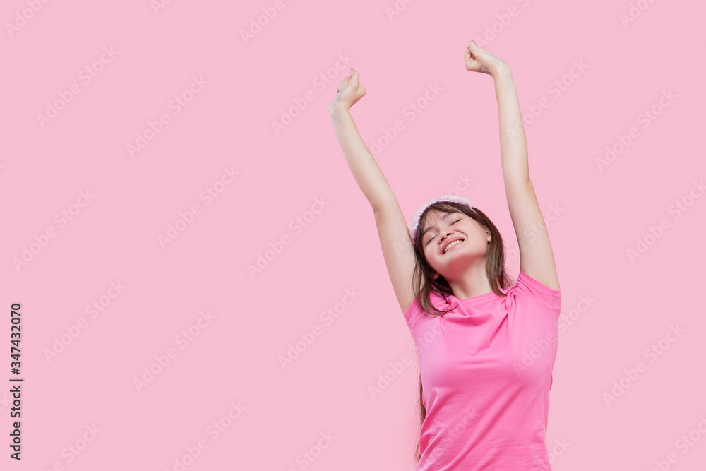 Young asian woman in sleeping eye mask yawning and holding alarm clock isolated on pink. Sleepless night Young asian woman in sleeping eye mask yawning and holding alarm clock isolated on pink. Sleepless night