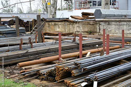 Photo of piles of pallets outdoors black metal lie