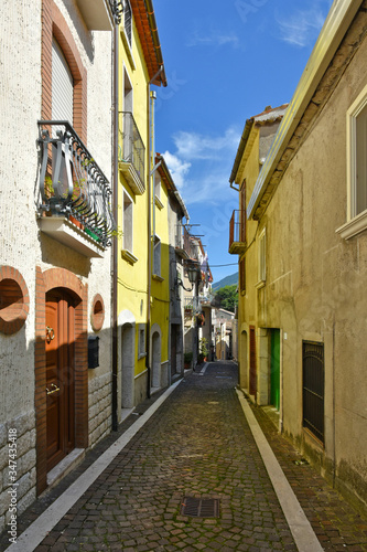 A narrow street between the old houses of the village of Pietraroja, in the province of Benevento, Italy