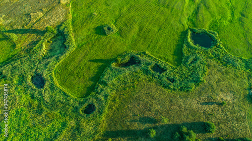 widok z drona na jeziora i zielone pola