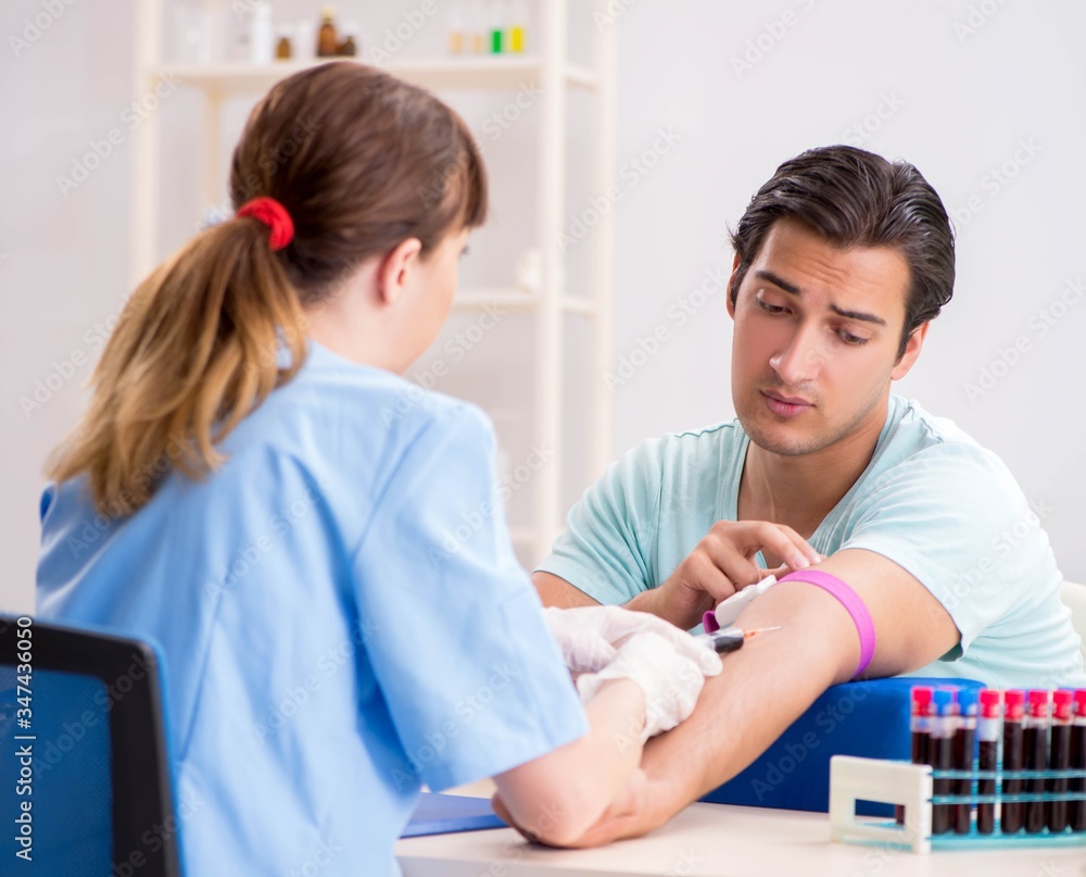 Young patient during blood test sampling procedure Young patient during blood test sampling procedure