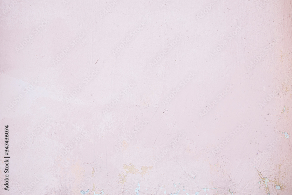 Pink concrete wall with chipped and scratches. Aged texture and background