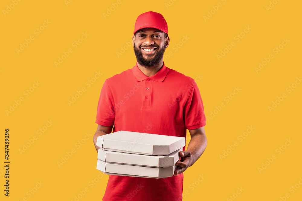 Pizzeria Courier Man Delivering Pizza Standing On Yellow Studio Background Pizzeria Courier Man Delivering Pizza Standing On Yellow Studio Background