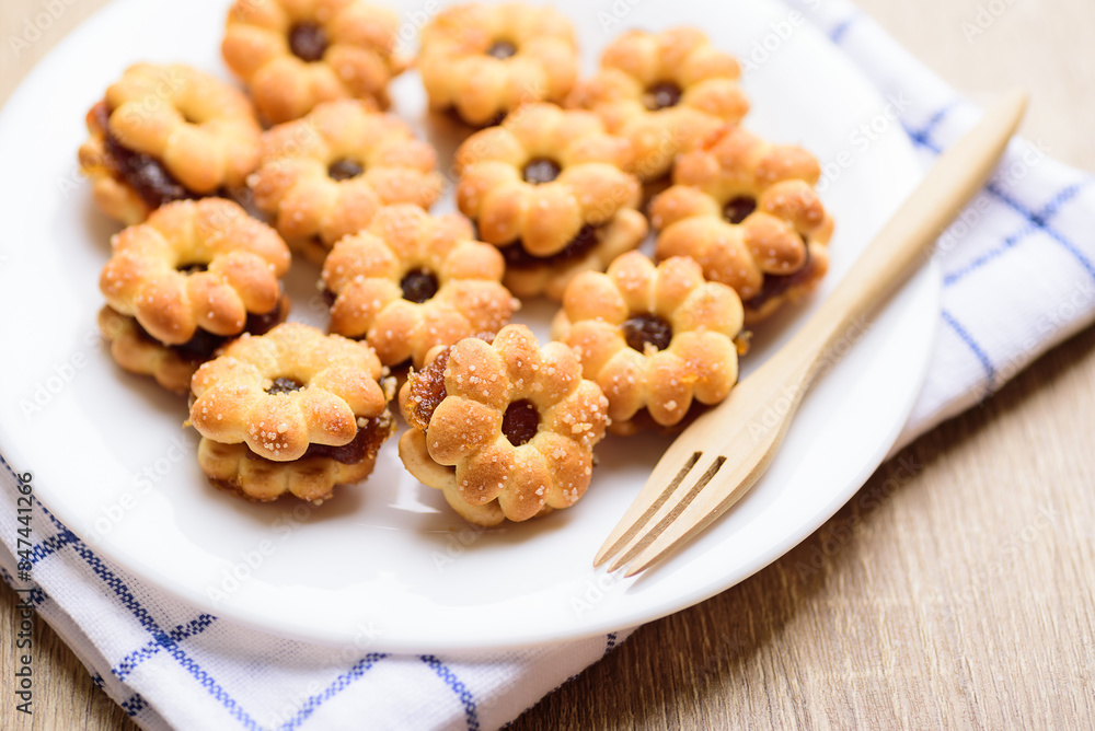 Cracker with pineapple jam (flower shape) on plate ready to eating, Thai snack Cracker with pineapple jam (flower shape) on plate ready to eating, Thai snack