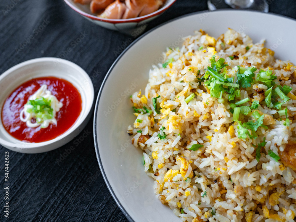 Egg Fried Rice Golden yellow
Soft, fragrant rice, sprinkled with spring onion, coriander on a white bowl,With Chicken Sausage
fried,With tomato sauce, cut in sour taste,Orange juice on glass Egg Fried Rice Golden yellow
Soft, fragrant rice, sprinkled with spring onion, coriander on a white bowl,With Chicken Sausage
fried,With tomato sauce, cut in sour taste,Orange juice on glass