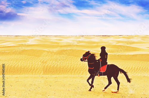 Bedouin ride horse at Sahara desert in Tunisia