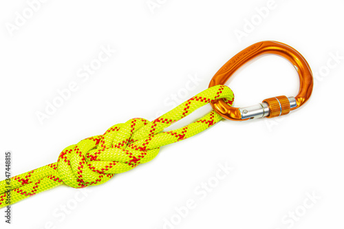 double Flemish loop or figure eight 8 knot with new colored aluminum carabiner. equipment use for attaching rope to climbing harness and create a mustache self insurance. isolated on white background