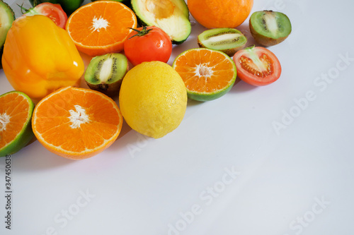 Fototapeta Naklejka Na Ścianę i Meble -  Banner from various vegetables and fruits isolated on white background, top view, creative flat layout. Concept of healthy eating, food background. Frame of vegetables with space for text.