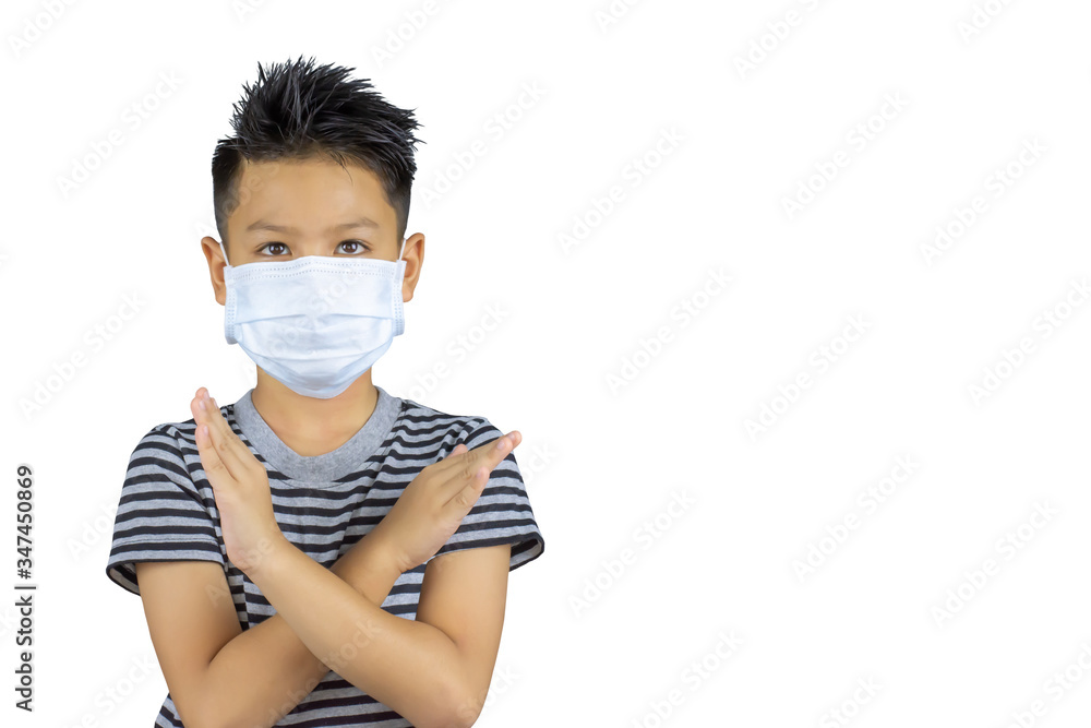 Isolated Asian boy wearing a mask and raised his arms in the shape of a cross on a white background with clipping path. Isolated Asian boy wearing a mask and raised his arms in the shape of a cross on a white background with clipping path.