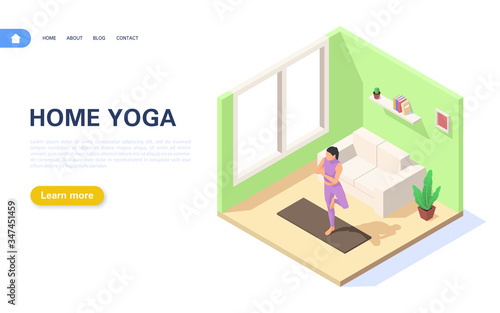 Concept of doing yoga at home. A girl is standing in the vrikshasana position in her apartment.