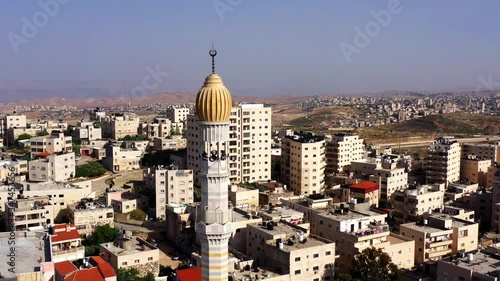 Mosque Tower minaret in Shuafat Refugee Camp, Jerusalem-Aerial View
Beautiful Drone footage with Jordan desert mountain, Jeusalem 
 photo