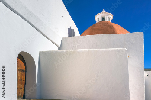 Mediterranean traditional architecture in Ibiza: white small church in Santa Eularia des Riu photo