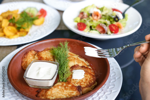 Potato pancakes with with sour cream and dill
