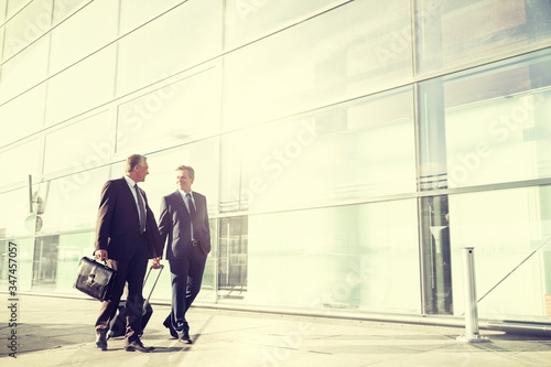 Portrait of businessmen walking in airport