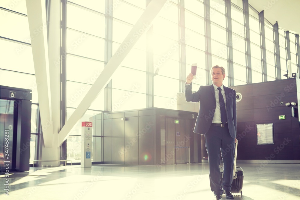Portrait of mature businessman boarding the aircraft in airport Portrait of mature businessman boarding the aircraft in airport