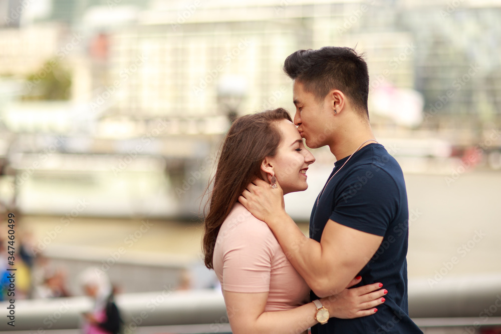 a young man giving his girlfriend a kiss a young man giving his girlfriend a kiss