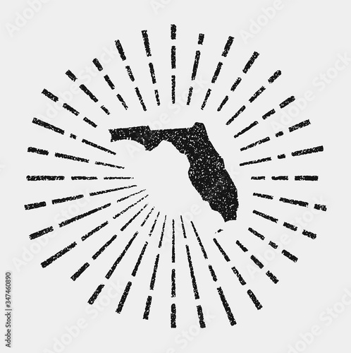 Vintage map of Florida. Grunge sunburst around the US state. Black Florida shape with sun rays on white background. Vector illustration.