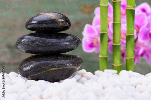 Japanese zen garden with stacked stones and bamboo
