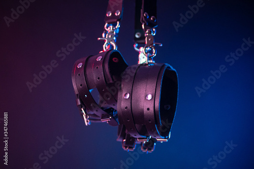 Set of erotic toys for BDSM. The game of sexual slavery with a whip, gag and leather blindfold. Intimate sex games photo