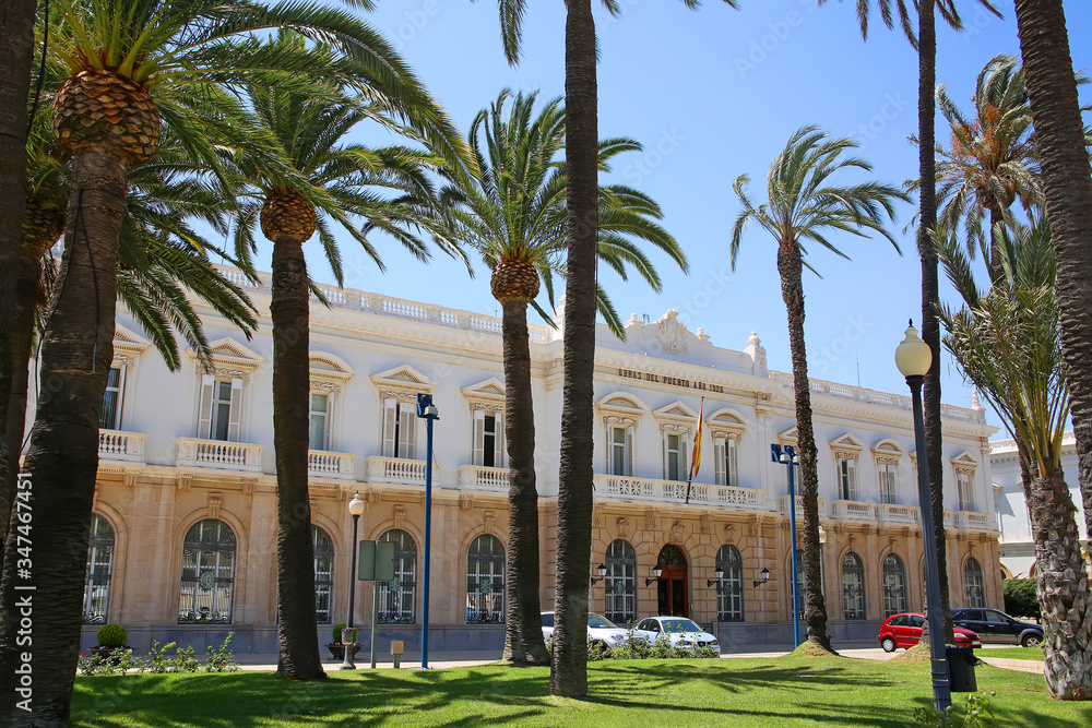 The beautiful Port Authority of Cartagena building under the palm trees, Murcia, Spain.