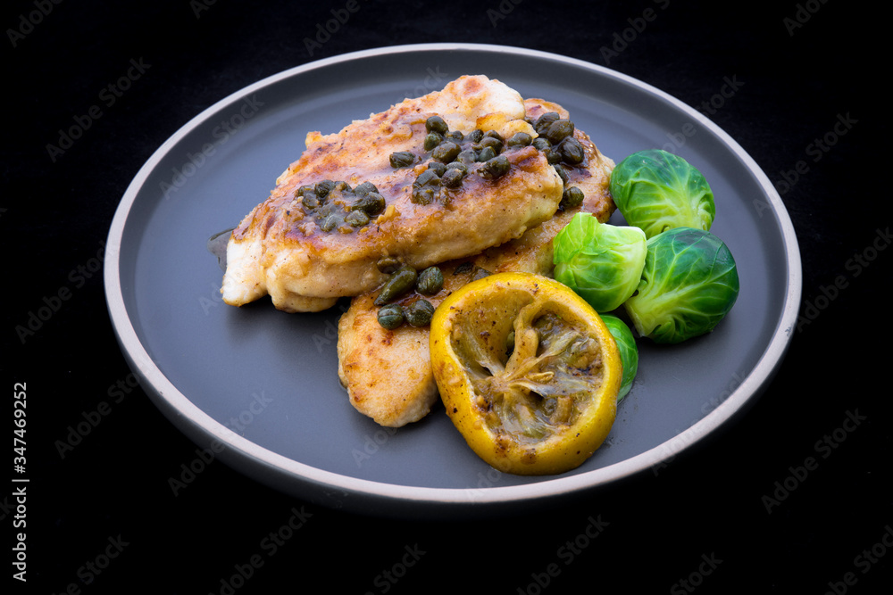 Italian food Lemon chicken Piccata  with Brussels Sprouts