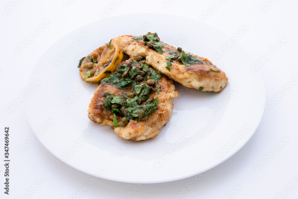 Italian food Lemon chicken Piccata with parsley Italian food Lemon chicken Piccata with parsley