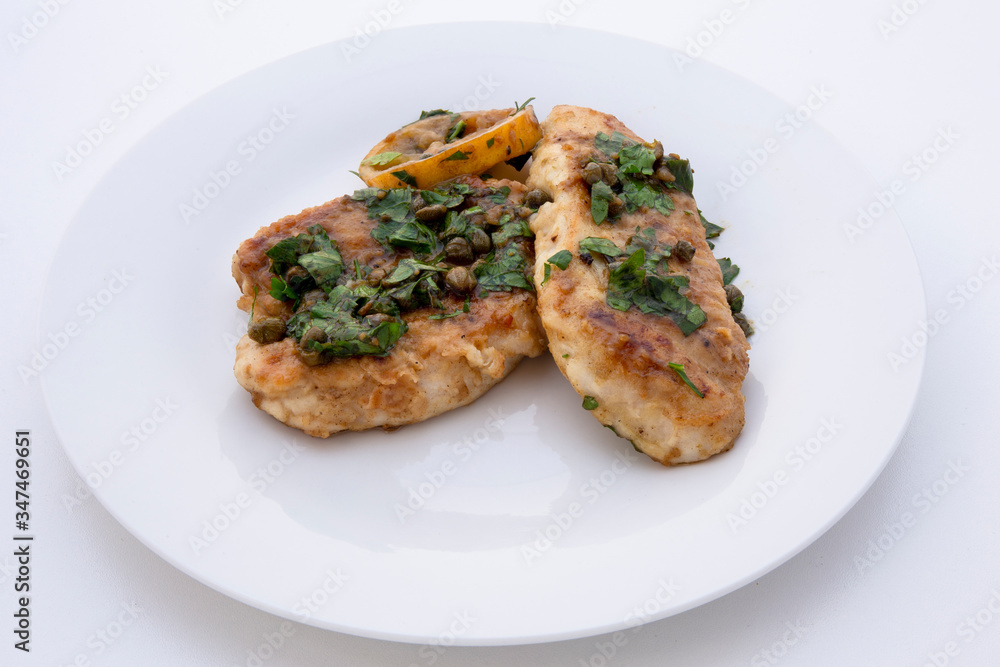 Italian food Lemon chicken Piccata with parsley