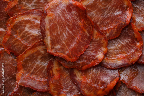 Acorn-fed Iberian loin cut into slices seen from above