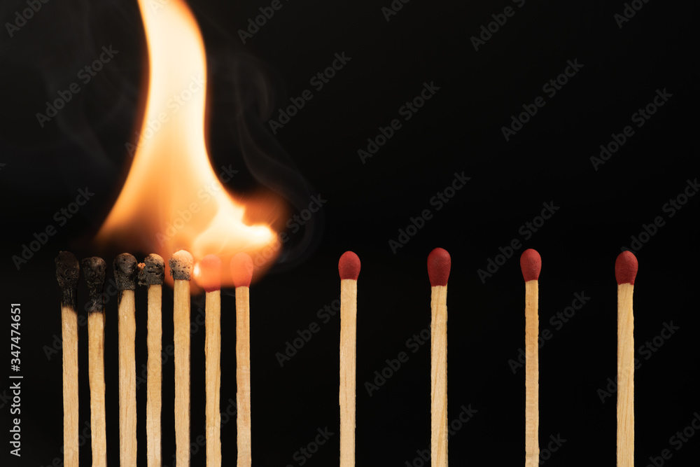 Matchsticks burn, concept of how to stop the coronavirus or covid-19 from spreading: Stay at home or Social distancing concept. Matchsticks burn, concept of how to stop the coronavirus or covid-19 from spreading: Stay at home or Social distancing concept.