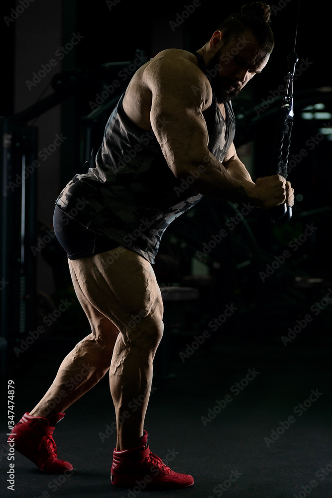 Bodybuilder athletic man workout muscles exercise Bodybuilder athletic man workout muscles exercise