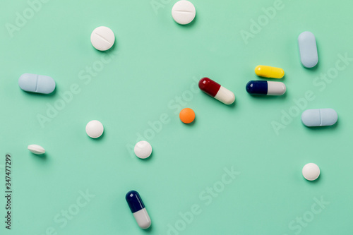 Different medications. Green backdrop.
