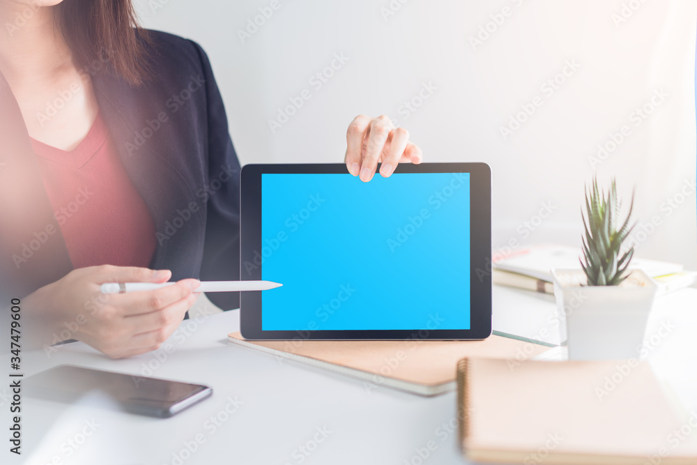 Business modern technology concept: Woman present her work by using tablet with clipping path Business modern technology concept: Woman present her work by using tablet with clipping path