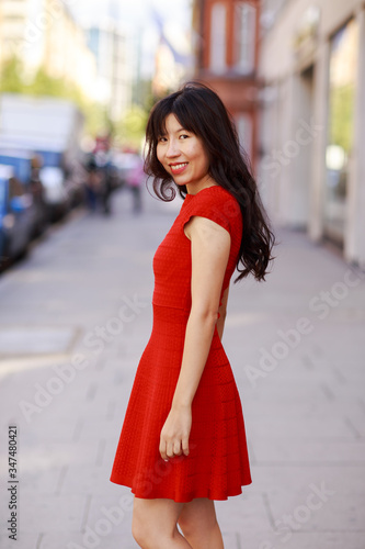 portrait of a beautiful young woman wearing a dress