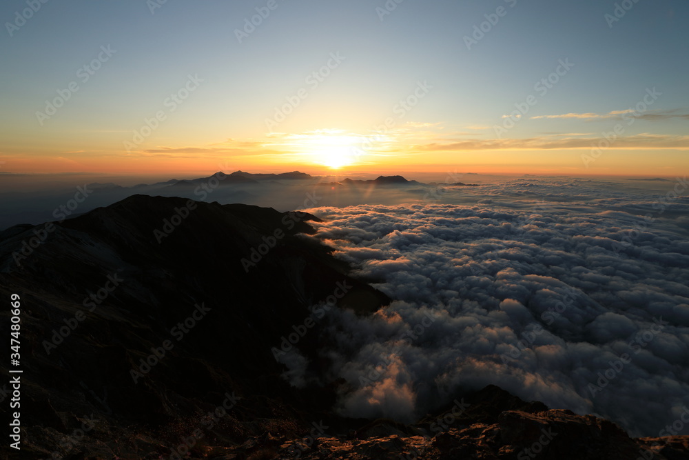 Clouds and mountain in the early morning in Shirouma dake, Nagano Clouds and mountain in the early morning in Shirouma dake, Nagano