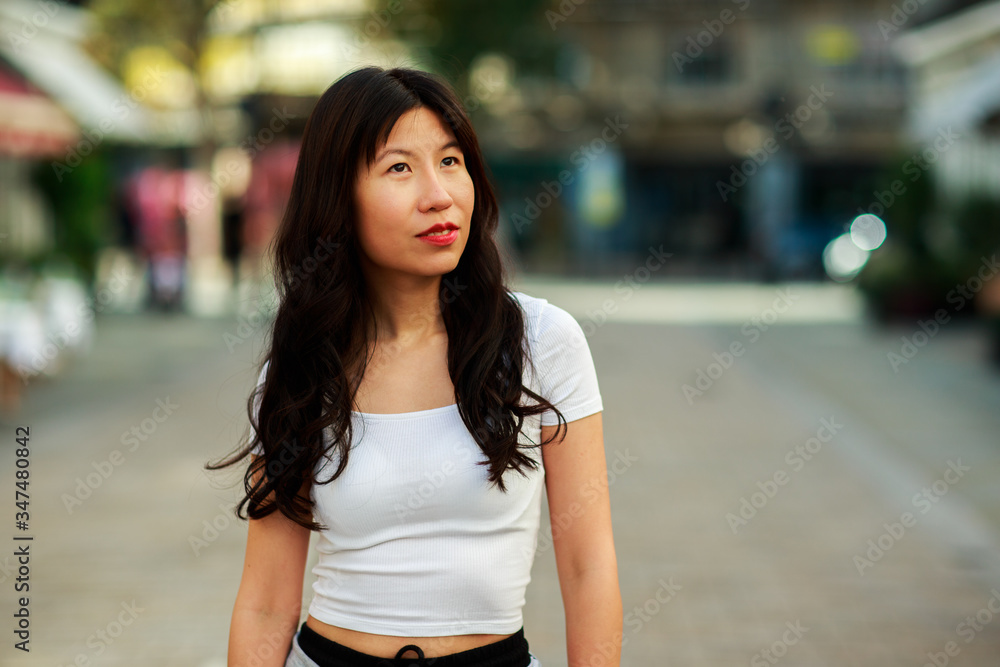 a young chinese lady in the street