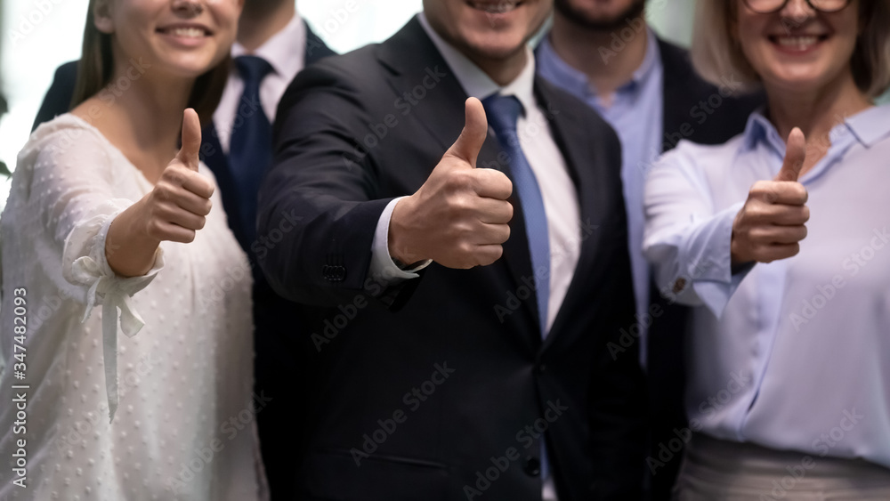 Diverse businesspeople stand in row showing thumbs up close up. Gesture of best recommendations, group of people advise company services, professionals team help you, carrier opportunity offer concept Diverse businesspeople stand in row showing thumbs up close up. Gesture of best recommendations, group of people advise company services, professionals team help you, carrier opportunity offer concept