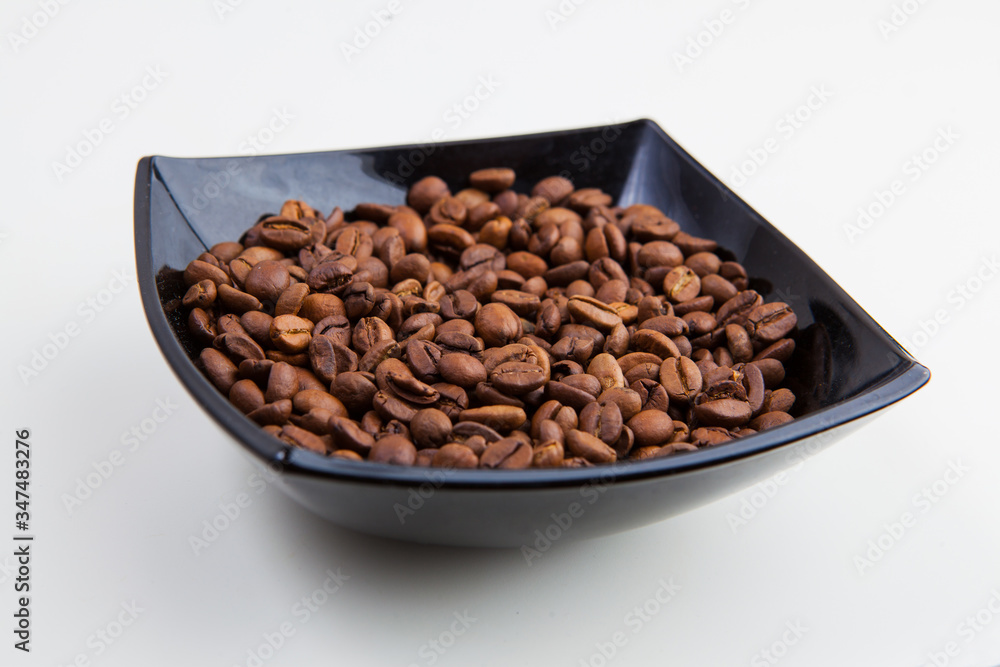roasted coffee beans on a white background roasted coffee beans on a white background