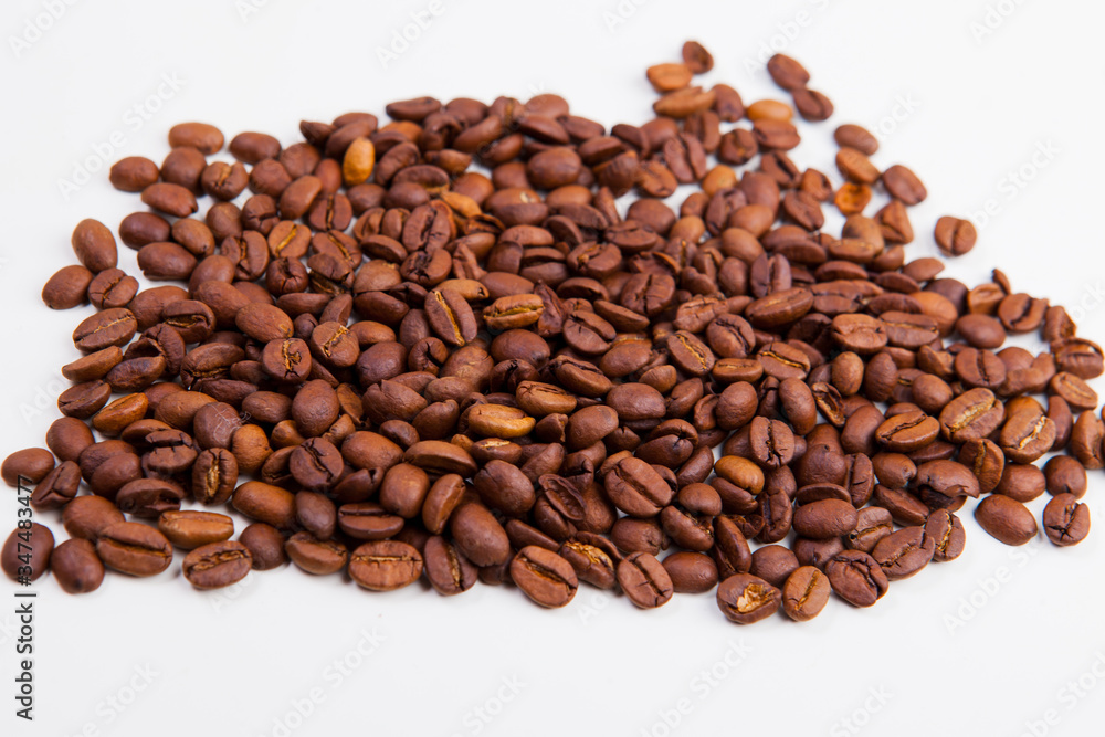roasted coffee beans on a white background roasted coffee beans on a white background