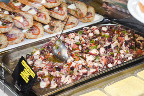 Octopus salad with lemon or salad de poulpe on white dish french nicoise food © Alexe