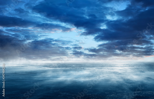 Night seascape. Dark landscape with a marine background and sunset, moon. Abstract night landscape in blue light. Reflection of the moon in the night water. Empty futuristic landscape.