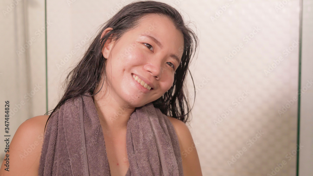 home lifestyle portrait of young beautiful and happy Asian Korean woman with bath towel smiling fresh and cheerful after taking shower enjoying morning routine home lifestyle portrait of young beautiful and happy Asian Korean woman with bath towel smiling fresh and cheerful after taking shower enjoying morning routine