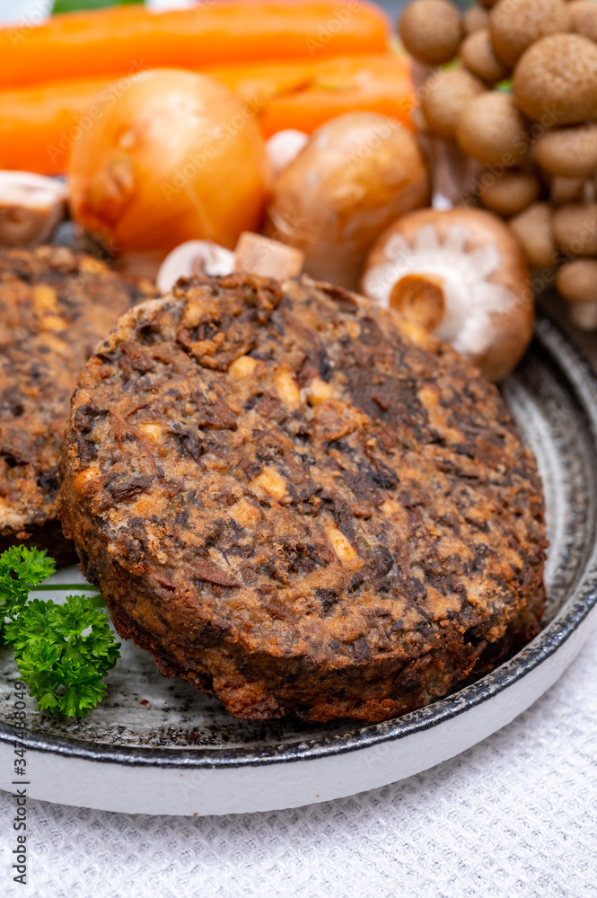 Tasty vegetarian food, burgers with champignons mushrooms, buna shimeji, carrot and onion Tasty vegetarian food, burgers with champignons mushrooms, buna shimeji, carrot and onion