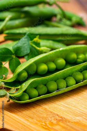 New harvest of ripe green peas legumes
