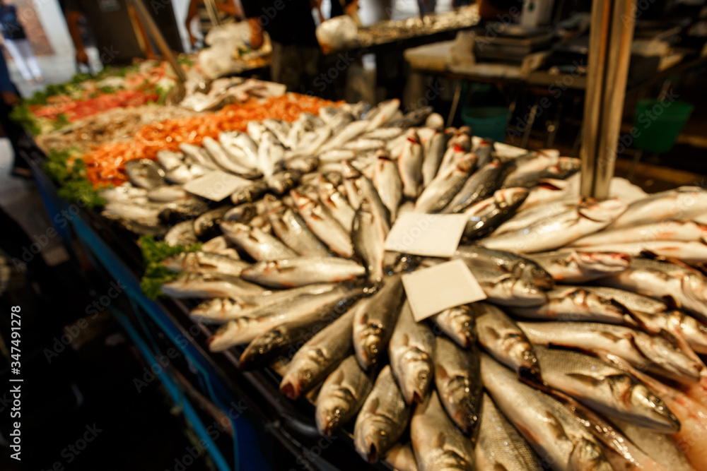 Fresh fish in fish market. Unfocused image