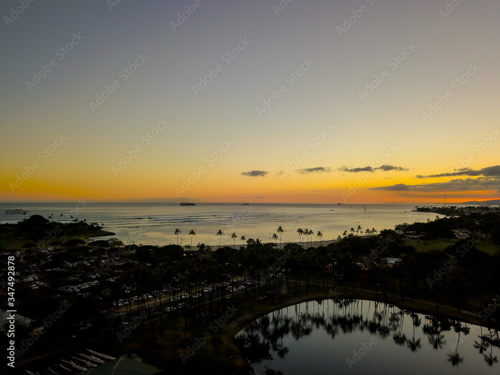 Reflections of Ala Moana Beach Park at Sunset