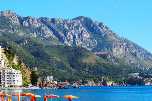 Beautiful seascape. Mountains, pebble beach and sea.Picturesque town on the Mediterranean coast. Soft focus.