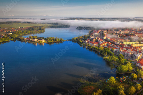 Foggy morning at the Elk Lake near Elk city. Masuria, Poland.