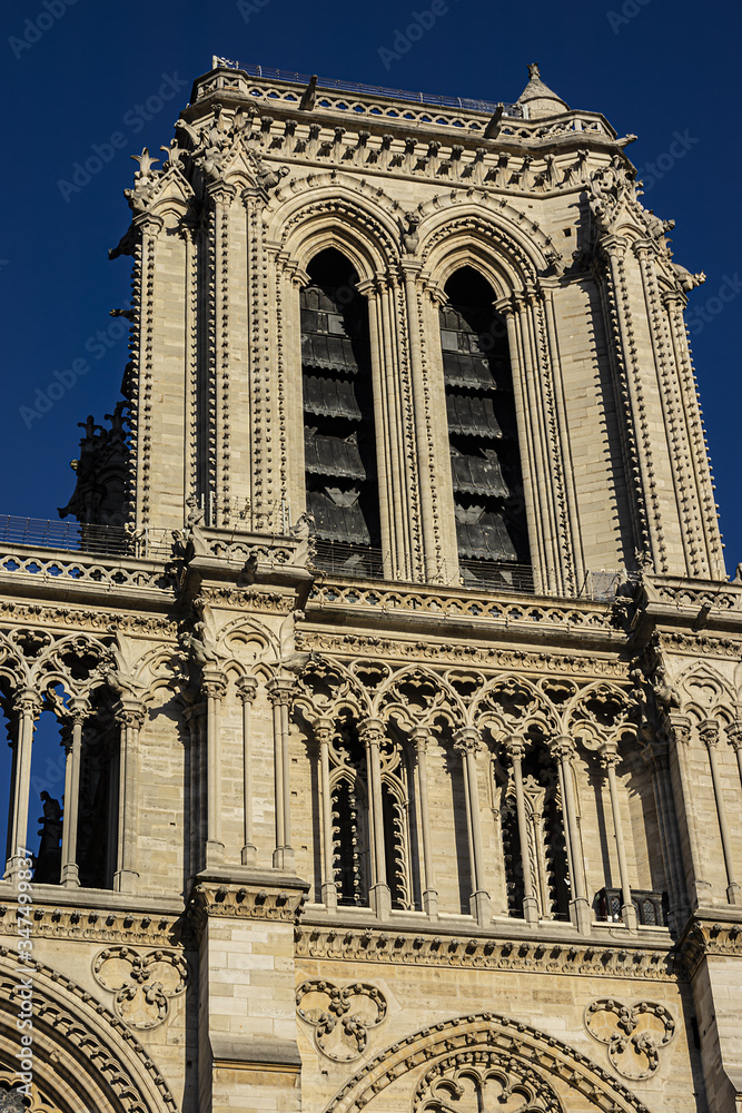 Architectural fragments of the portal of the Cathedral of Notre Dame de Paris - famous Gothic, Roman Catholic cathedral. Cite Island, Paris, France. Architectural fragments of the portal of the Cathedral of Notre Dame de Paris - famous Gothic, Roman Catholic cathedral. Cite Island, Paris, France.