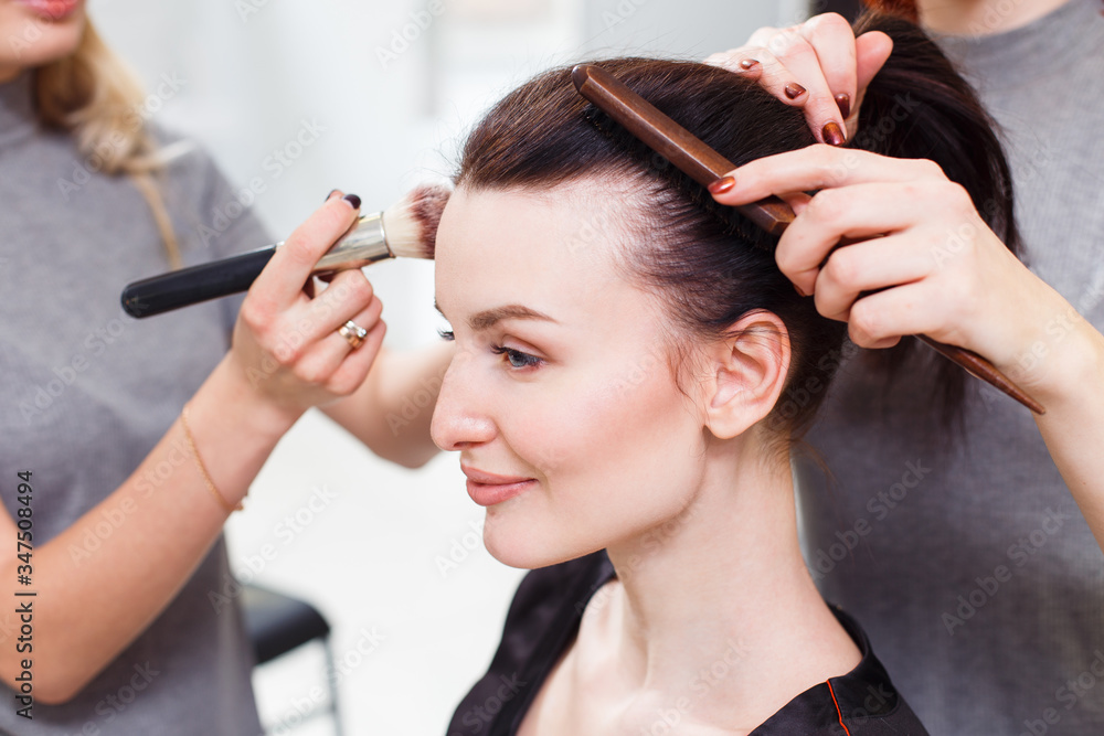 Fototapeta premium Makeup and hairstyle for a beautiful model