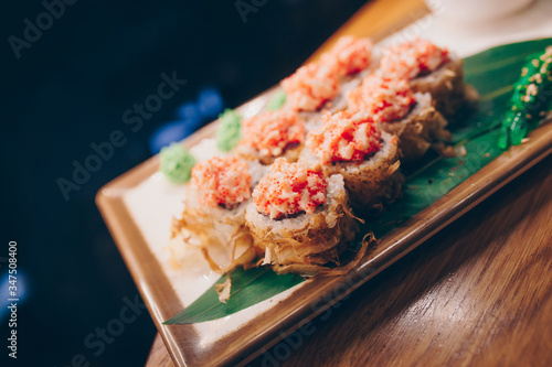 Large set of Sushi Rolls Warm Ebi Sake Unagi Spring. A lot assortment Philadelphia roll Dishes from Japanese raw fish in one plate in traditional restaurant. Japan food menu service